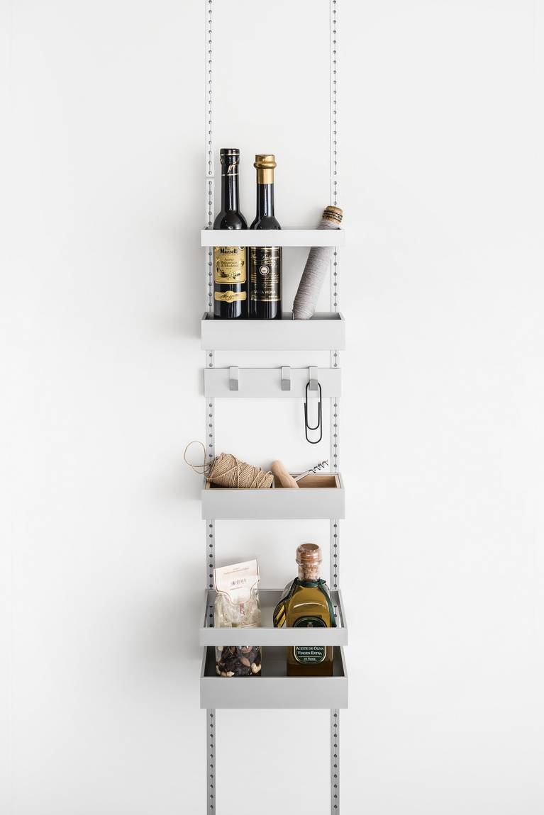 Storage trays and hook railing in the SieMatic MultiMatic interior organization system for jars, boxes and small items - even for narrow cabinet doors