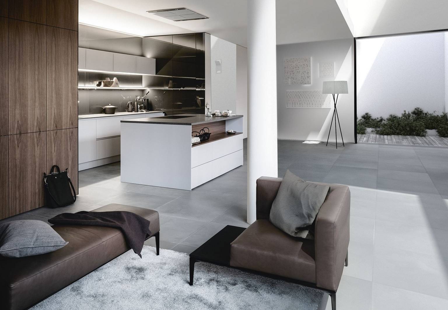 SieMatic Pure S2 SE tall cabinets in noble walnut veneer meld kitchen and living areas