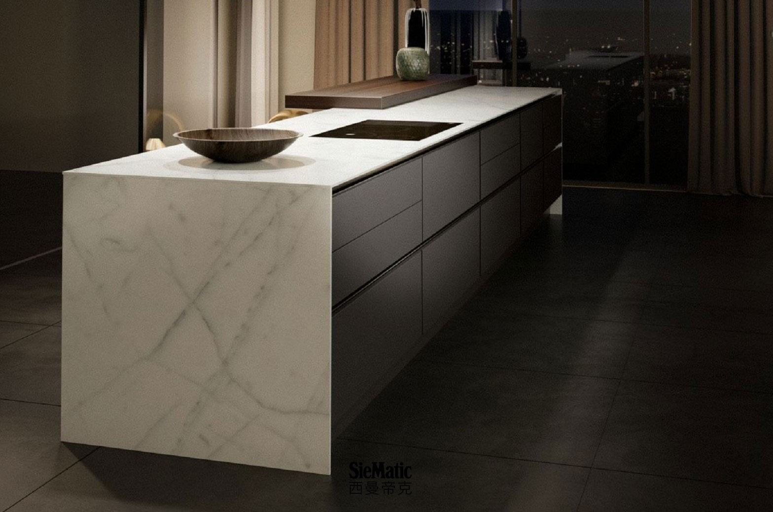 Minimalist kitchen design with handleless island, with SieMatic StoneDesign countertop and side panels in bright marble